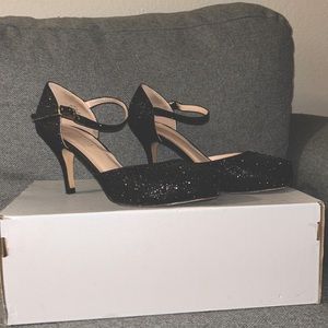 Black rhinestoned 3-inch heels.